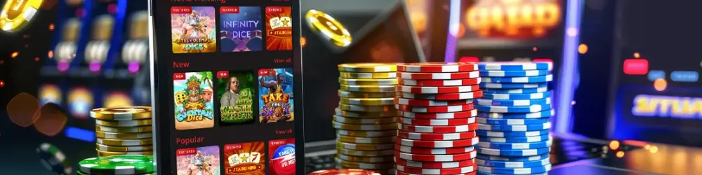 Stacks of poker chips and a smartphone displaying online games, representing digital gaming and casino options.